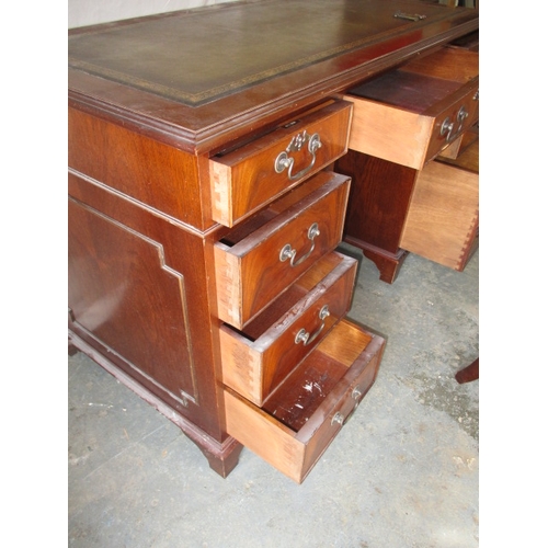 323 - A 20th century 8 drawer pedestal desk, with green inset writing surface, comes in 3 parts for ease o... 