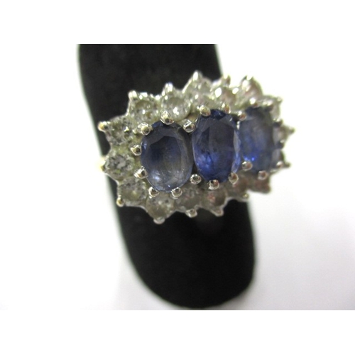 13 - An 18ct gold, diamond and sapphire ring, approx. ring size ‘P’, approx. weight 4.9g having 3 pale bl... 