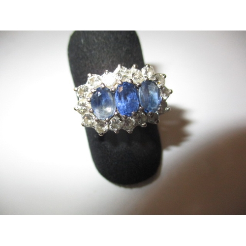 13 - An 18ct gold, diamond and sapphire ring, approx. ring size ‘P’, approx. weight 4.9g having 3 pale bl... 