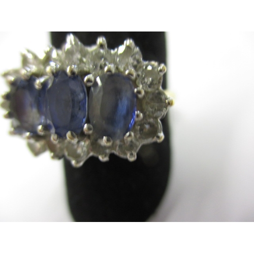 13 - An 18ct gold, diamond and sapphire ring, approx. ring size ‘P’, approx. weight 4.9g having 3 pale bl... 