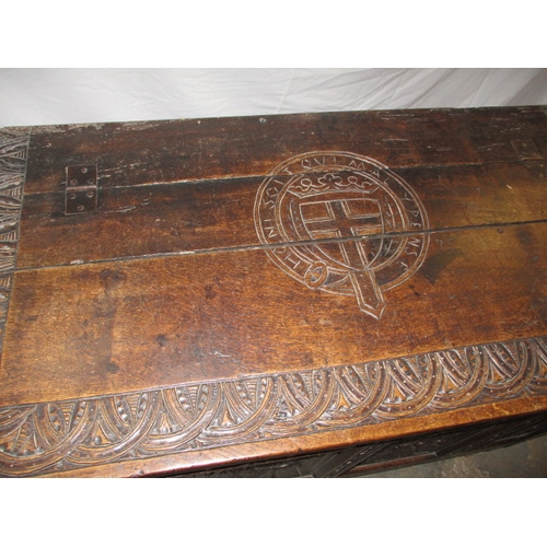 318 - An antique oak coffer, the carved front panel with Scottish Thistle and an English rose either side ... 