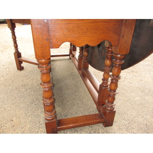 316 - A large antique oak drop leaf dining table, approx. length 197cm approx. width with leaves up 155cm,... 