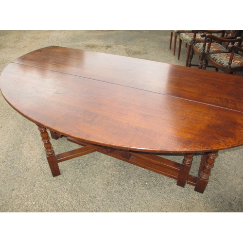 316 - A large antique oak drop leaf dining table, approx. length 197cm approx. width with leaves up 155cm,... 