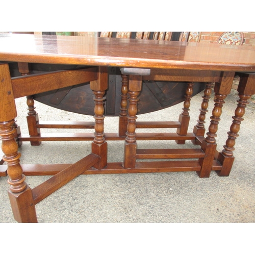 316 - A large antique oak drop leaf dining table, approx. length 197cm approx. width with leaves up 155cm,... 