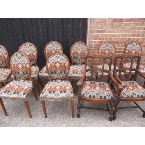 317 - 10 dining chairs comprising of 8 Victorian walnut spoon back dining chairs and 2 closely matched oak... 