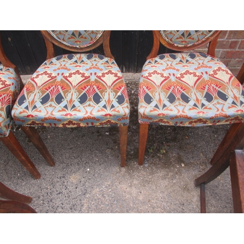 317 - 10 dining chairs comprising of 8 Victorian walnut spoon back dining chairs and 2 closely matched oak... 