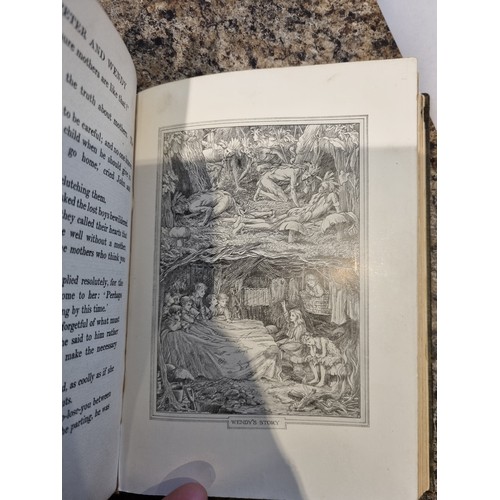 237 - Peter and Wendy hardback first edition by J M Barrie, dated 1911, in used condition with bumping to ... 