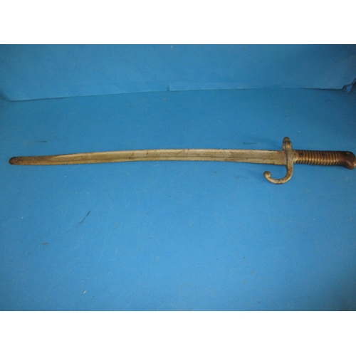 9 - An antique bayonet, approx. length 64cm having damage and over painting