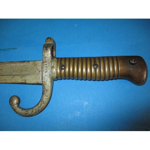 9 - An antique bayonet, approx. length 64cm having damage and over painting