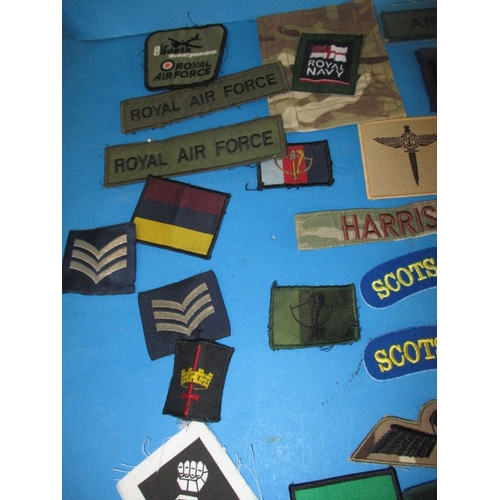 12 - A parcel of British military cloth insignia badges, all in good pre-owned condition