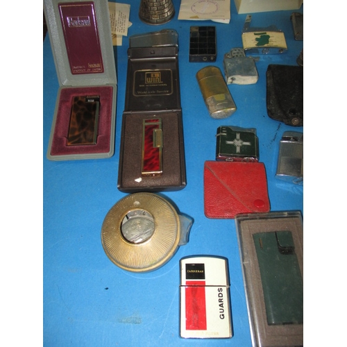 13 - A large quantity of vintage cigarette lighters, all in used condition and not tested as to function