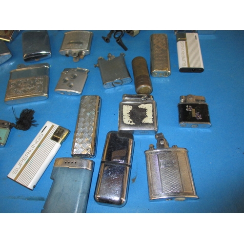 13 - A large quantity of vintage cigarette lighters, all in used condition and not tested as to function