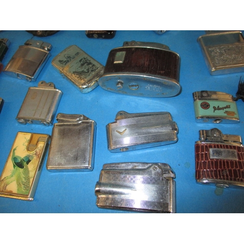 13 - A large quantity of vintage cigarette lighters, all in used condition and not tested as to function