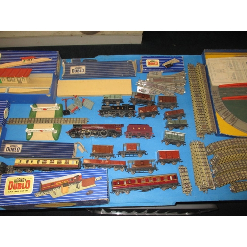 15 - A large quantity of vintage Hornby Dublo ‘00’ gauge 3 rail model railway items, to include locos rol... 