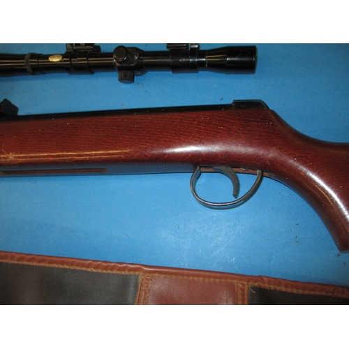 16 - A vintage BSA Meteor .22 air rifle in working order with scope and gun slip having general use relat... 