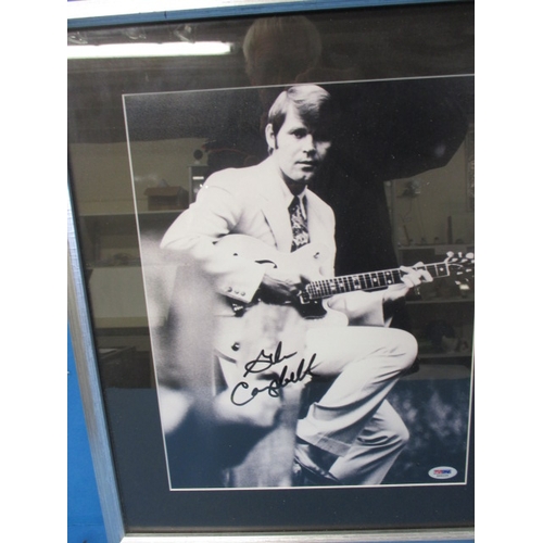 25 - Glen Campbell autographed photo in frame, with certificate of authenticity verso, approx. frame size... 