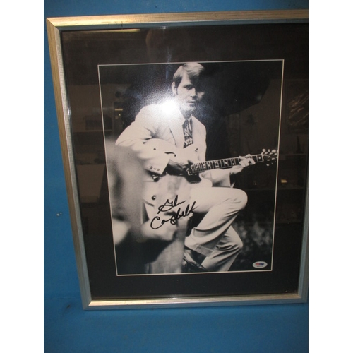 25 - Glen Campbell autographed photo in frame, with certificate of authenticity verso, approx. frame size... 