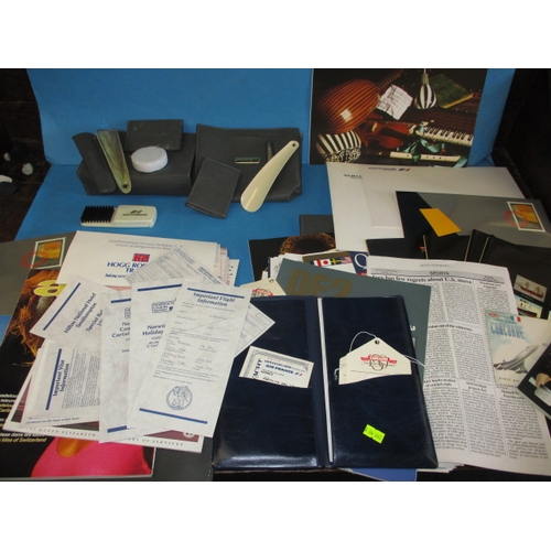 43 - A parcel of 1990s Concorde and QEII memorabilia, to include document pouches and booklets, all in go... 