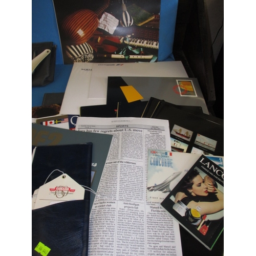 43 - A parcel of 1990s Concorde and QEII memorabilia, to include document pouches and booklets, all in go... 