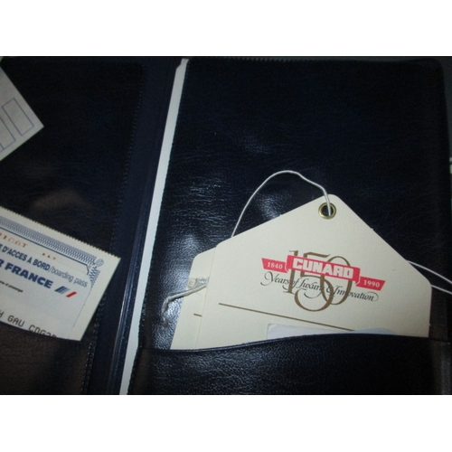 43 - A parcel of 1990s Concorde and QEII memorabilia, to include document pouches and booklets, all in go... 