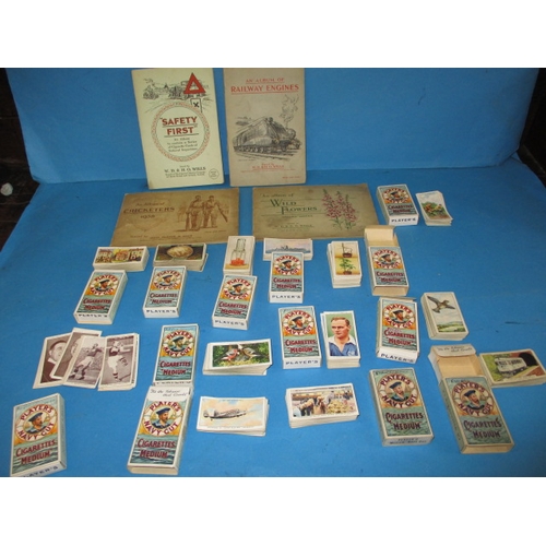 44 - A quantity of vintage cigarette cards, to include some sets in albums, all in used condition