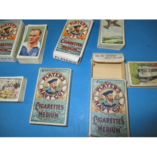 44 - A quantity of vintage cigarette cards, to include some sets in albums, all in used condition