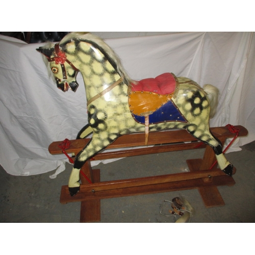 60 - A vintage hand carved rocking horse on safety rocker, having general age-related marks in useable co... 