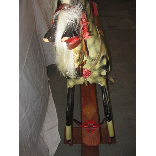 60 - A vintage hand carved rocking horse on safety rocker, having general age-related marks in useable co... 