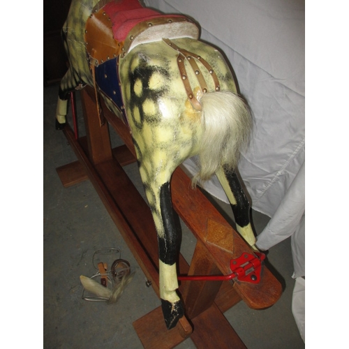 60 - A vintage hand carved rocking horse on safety rocker, having general age-related marks in useable co... 