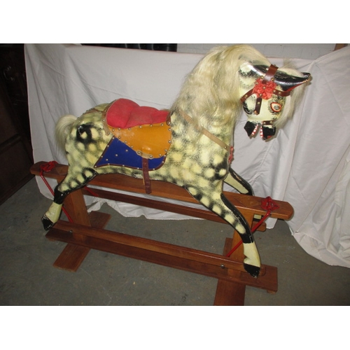 60 - A vintage hand carved rocking horse on safety rocker, having general age-related marks in useable co... 