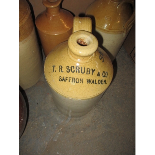 61 - A quantity of stoneware pots and bottles, some damages and some named