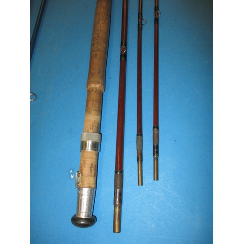 63 - A quantity of vintage fishing tackle, to include boxed reels and cane rods and a brass bait box, all... 