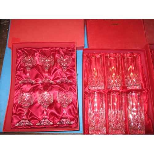 65 - A quantity of lead crystal drinking glasses, to include boxed sets of 6 and decanters, all with no o... 