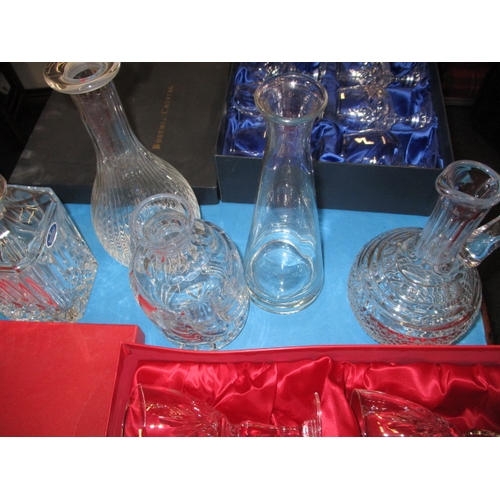 65 - A quantity of lead crystal drinking glasses, to include boxed sets of 6 and decanters, all with no o... 