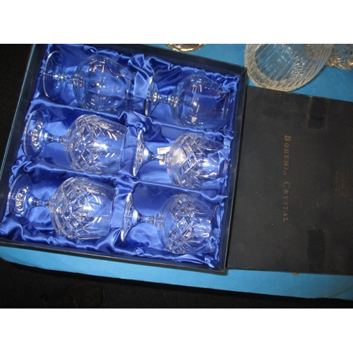 65 - A quantity of lead crystal drinking glasses, to include boxed sets of 6 and decanters, all with no o... 