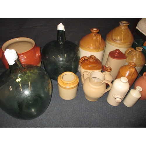 77 - A quantity of stoneware pots and 2 large glass carboys, to include a Stevens of Colchester ink bottl... 