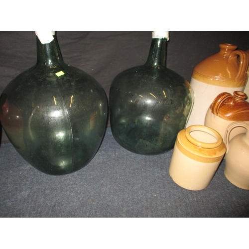 77 - A quantity of stoneware pots and 2 large glass carboys, to include a Stevens of Colchester ink bottl... 