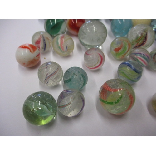 79 - A quantity of antique and later glass marbles, to include some German examples, all in used conditio... 