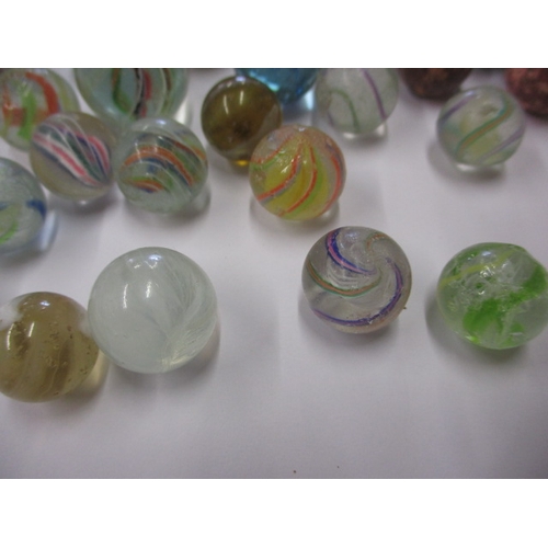 79 - A quantity of antique and later glass marbles, to include some German examples, all in used conditio... 