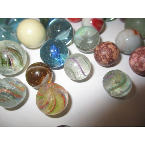 79 - A quantity of antique and later glass marbles, to include some German examples, all in used conditio... 