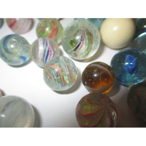 79 - A quantity of antique and later glass marbles, to include some German examples, all in used conditio... 