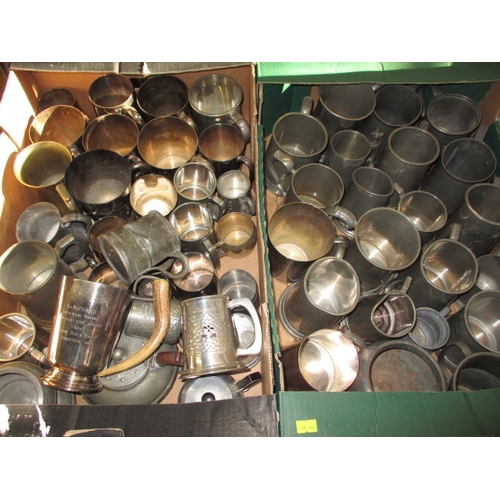 82 - A large quantity of pewter and plated tankards, some with military and railway dedications, all in u... 