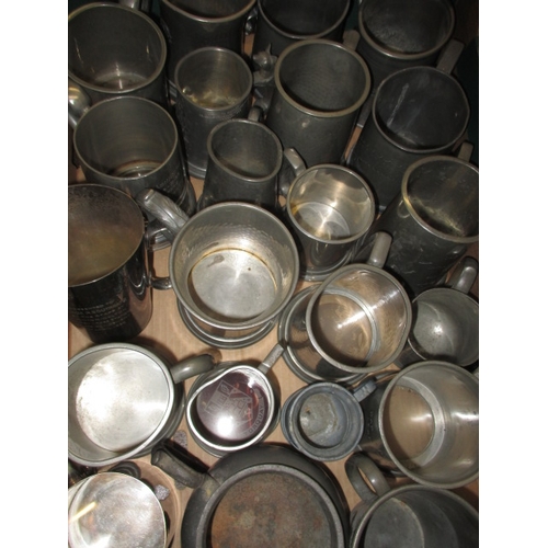 82 - A large quantity of pewter and plated tankards, some with military and railway dedications, all in u... 