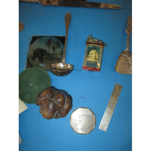 105 - A parcel of interesting collectables, to include some white metal items and a tin plate clockwork mo... 