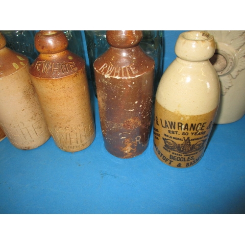 112 - A quantity of vintage bottles and stoneware pots, all in used condition