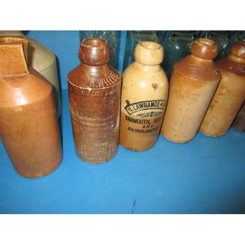 112 - A quantity of vintage bottles and stoneware pots, all in used condition