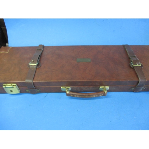 115 - An Italian leather hard case for a shotgun, will take 30inch barrels, pre-owned with keys and straps