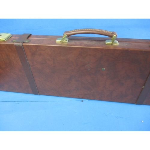 115 - An Italian leather hard case for a shotgun, will take 30inch barrels, pre-owned with keys and straps