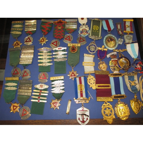 118 - A collection of medals and awards, Masonic and driving related, some silver examples, all in used co... 