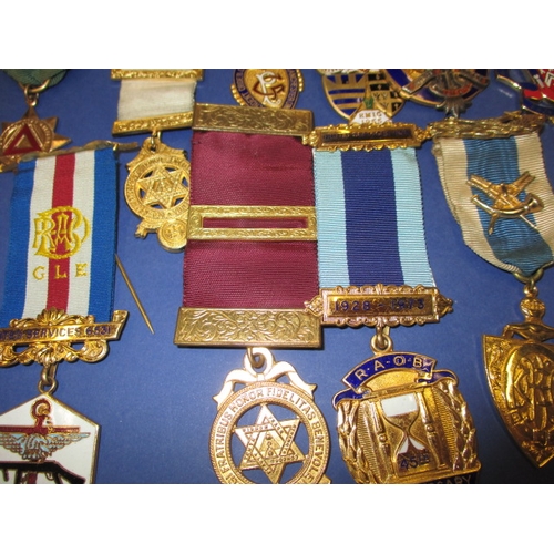 118 - A collection of medals and awards, Masonic and driving related, some silver examples, all in used co... 